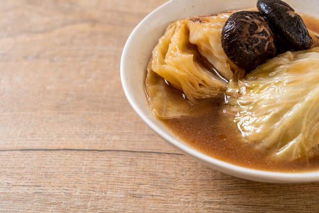 boiled cabbage in red soup with mushroom