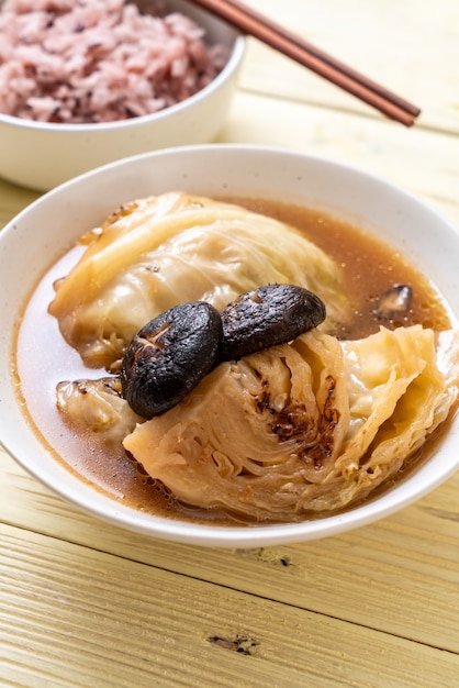 boiled cabbage in red soup with mushroom