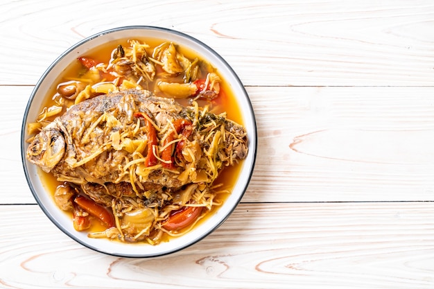 Boiled Carp fish with pickled lettuce