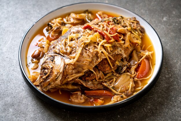 Boiled Carp fish with pickled lettuce