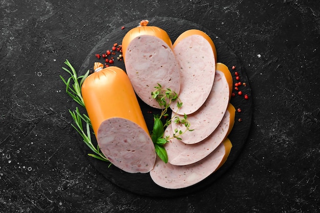 Boiled chicken sausage with spices and herbs Top view Free space for text