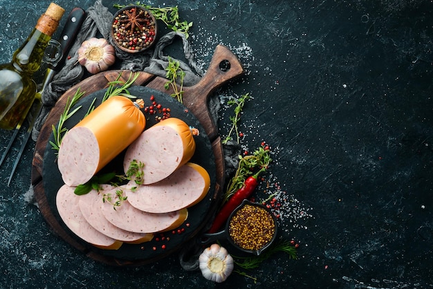 Boiled chicken sausage with spices and herbs Top view Free space for text