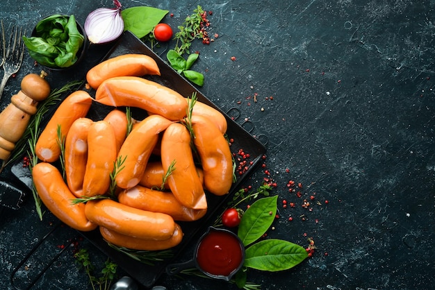 Boiled chicken sausages with spices and rosemary Barbecue Top view Rustic style