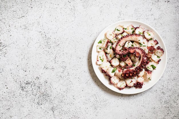 Boiled chopped octopus on a concrete table