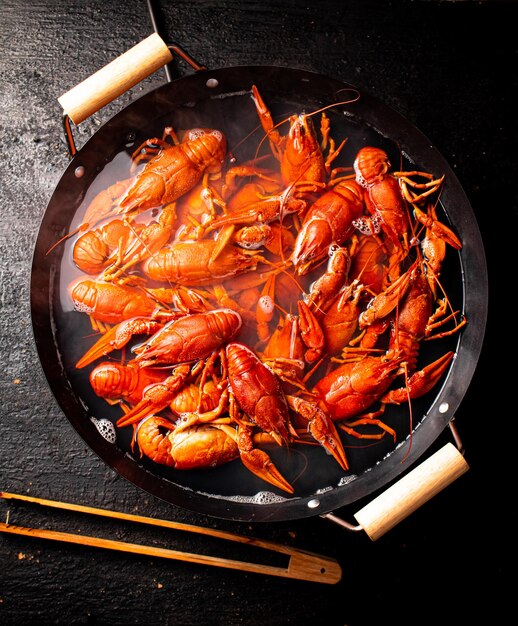 Boiled crayfish in a pot of water