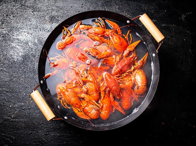 Boiled crayfish in a pot of water