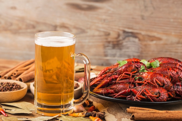 Boiled crayfish with beer on wooden
