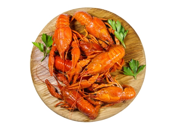 Boiled crayfish on wooden cutting board isolated on white background