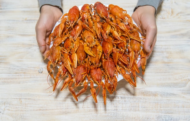 Boiled crayfish on the wooden table