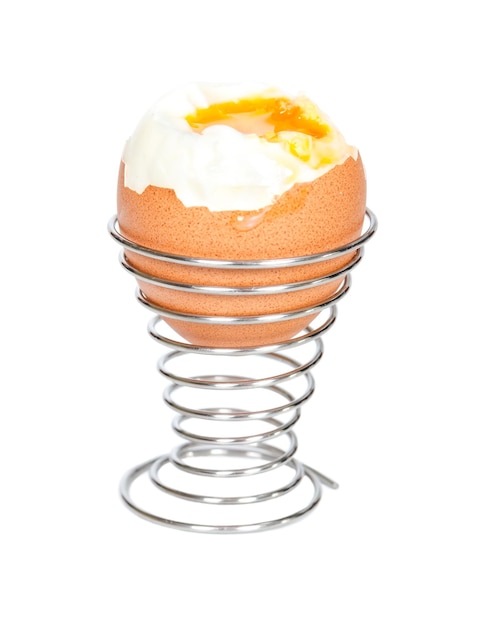 Boiled egg in metal stands isolated on white background