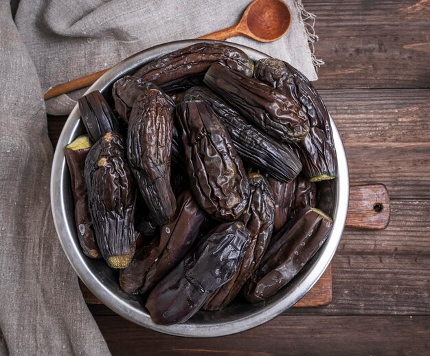 Boiled eggplants in an iron bowl