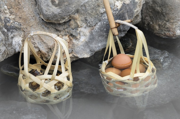 Boiled eggs in basket in nature hot springs