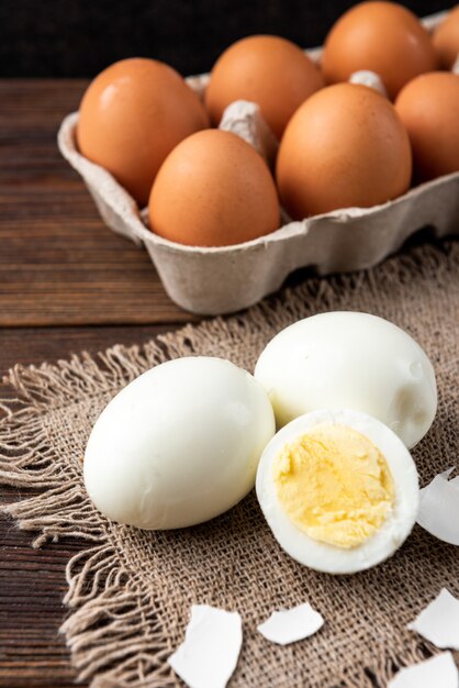 Boiled eggs on dark wooden table