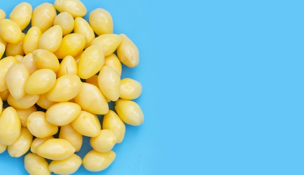 Boiled ginkgo nuts on blue background