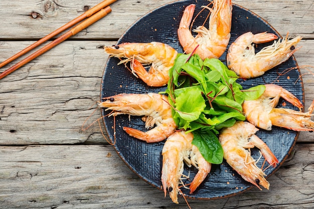 Boiled king prawns on a dark platter.Delicious boiled langoustine