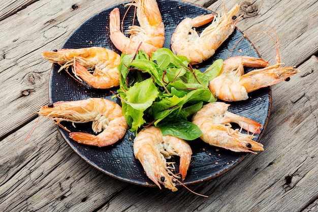 Boiled king prawns on a dark platter.Delicious boiled langoustine