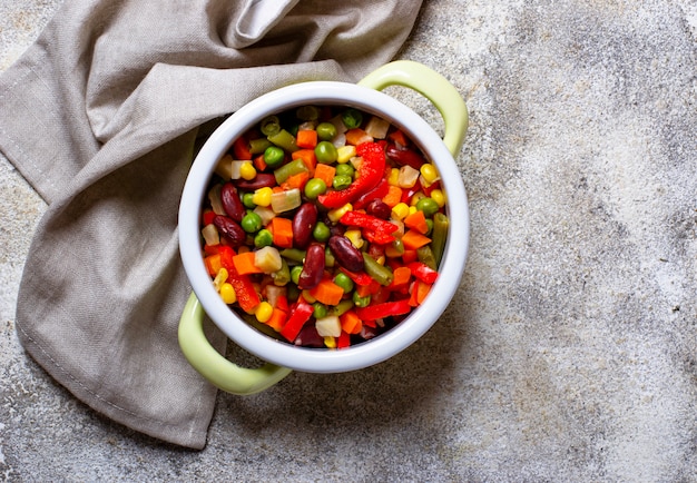 Boiled mix of vegetables in green pot