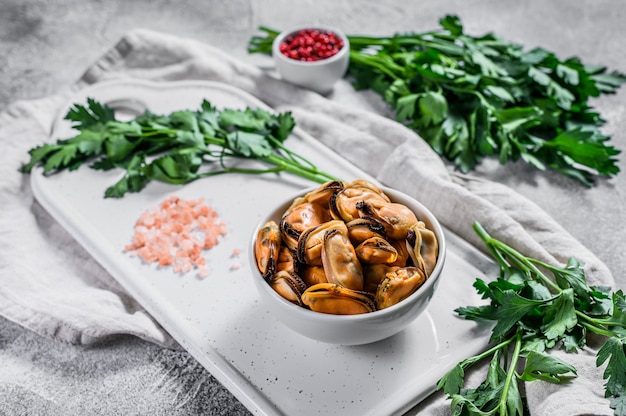 Photo boiled mussel meat on a cutting board.