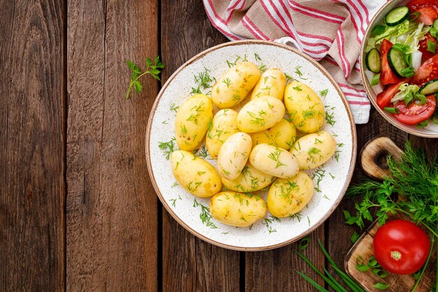 Boiled new potato with butter dill and green onion