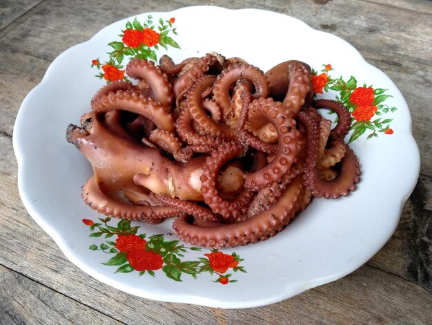 boiled octopus on a plate Indonesian culinary food