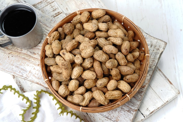 boiled peanuts in wooden plate ,on white background