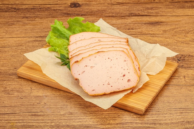 Boiled pork sausage over board