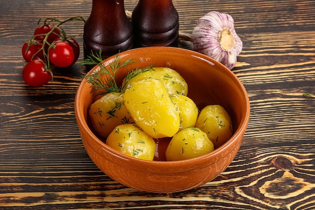 Boiled potato with oil and dill