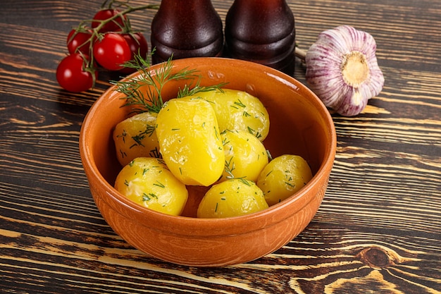 Boiled potato with oil and dill