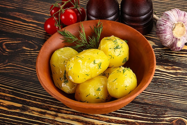 Boiled potato with oil and dill