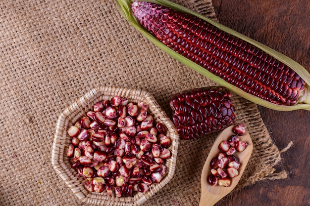 Boiled purple corn on wooden background