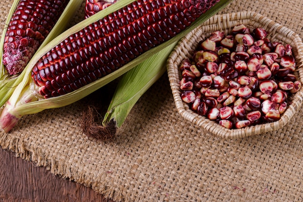 Boiled purple corn on wooden background