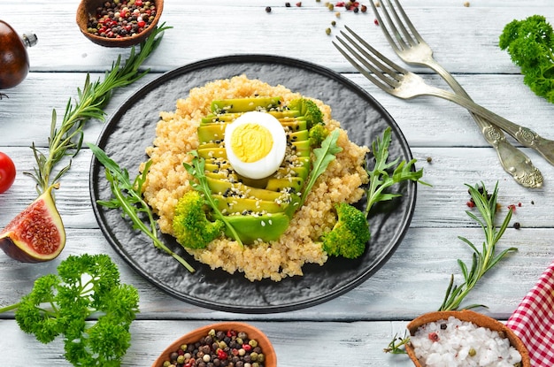 Boiled quinoa with avocado and spices Menu Free copy space Top view