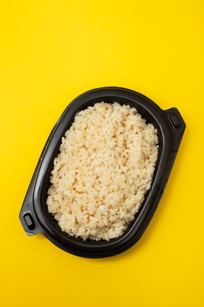 Boiled rice in black plastic box