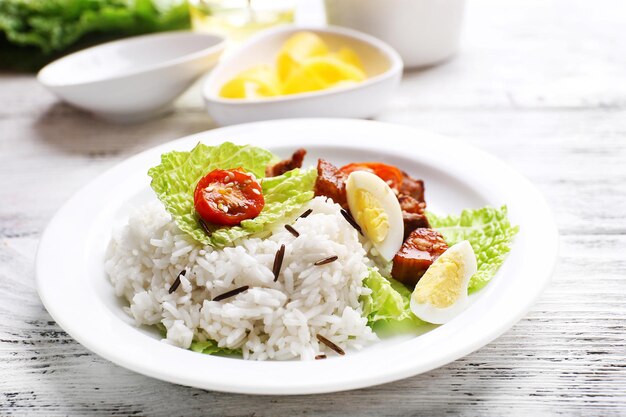 Boiled rice served on table closeup