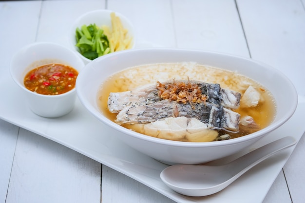 Photo boiled rice soup with sea bass