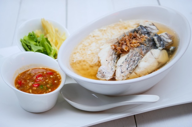 Photo boiled rice soup with sea bass