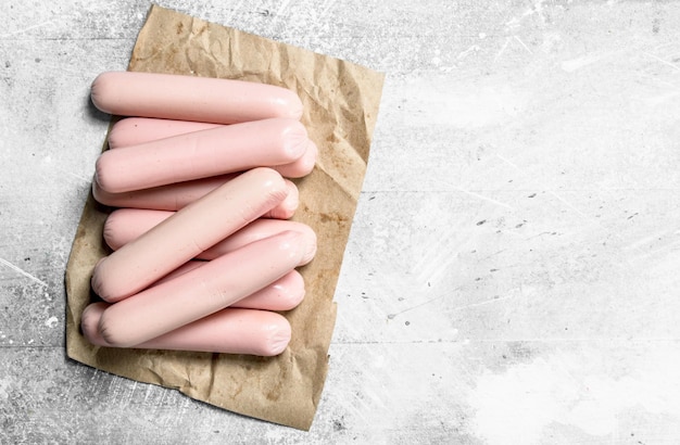 Boiled sausages on paper