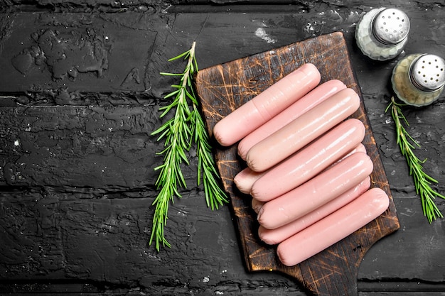 Boiled sausages with rosemary