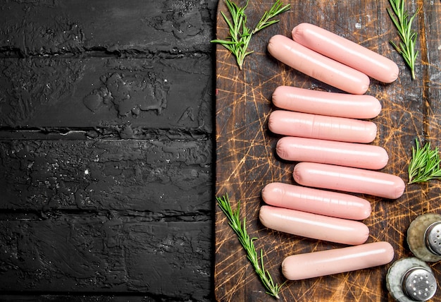 Boiled sausages with salt and pepper