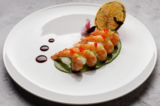 Boiled Shrimp with Lemon on a White Plate