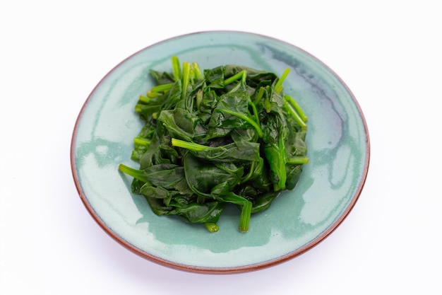 Boiled spinach on white background