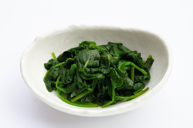 Boiled spinach on white background