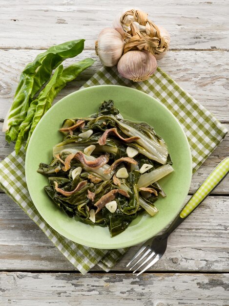 Boiled swiss chard salad with anchovy and garlic