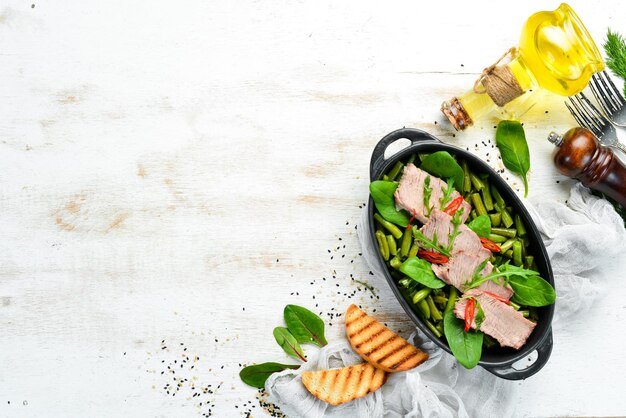 Boiled veal with green beans and spinach Diet food Rustic style