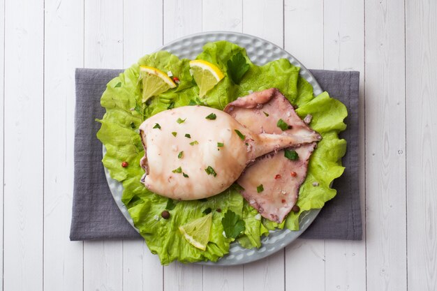 Boiled whole squid on a plate