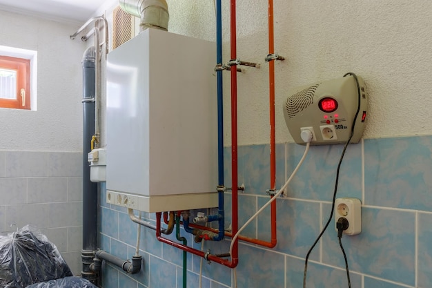 Photo boiler and pipes of the heating system of a house