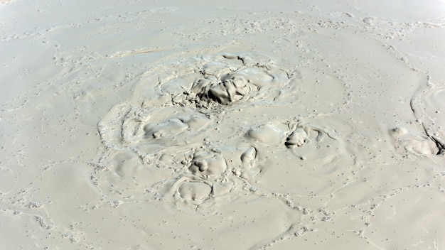 Boiling crater of mud volcano