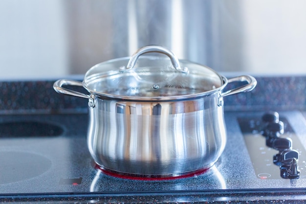 Boiling little gold and red potatoes in large cooking pot.