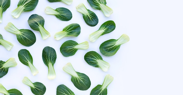 Bok choy on white wall.