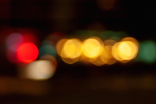 Bokeh of car headlights Blurred image of the light of street lamps and headlights of driving cars